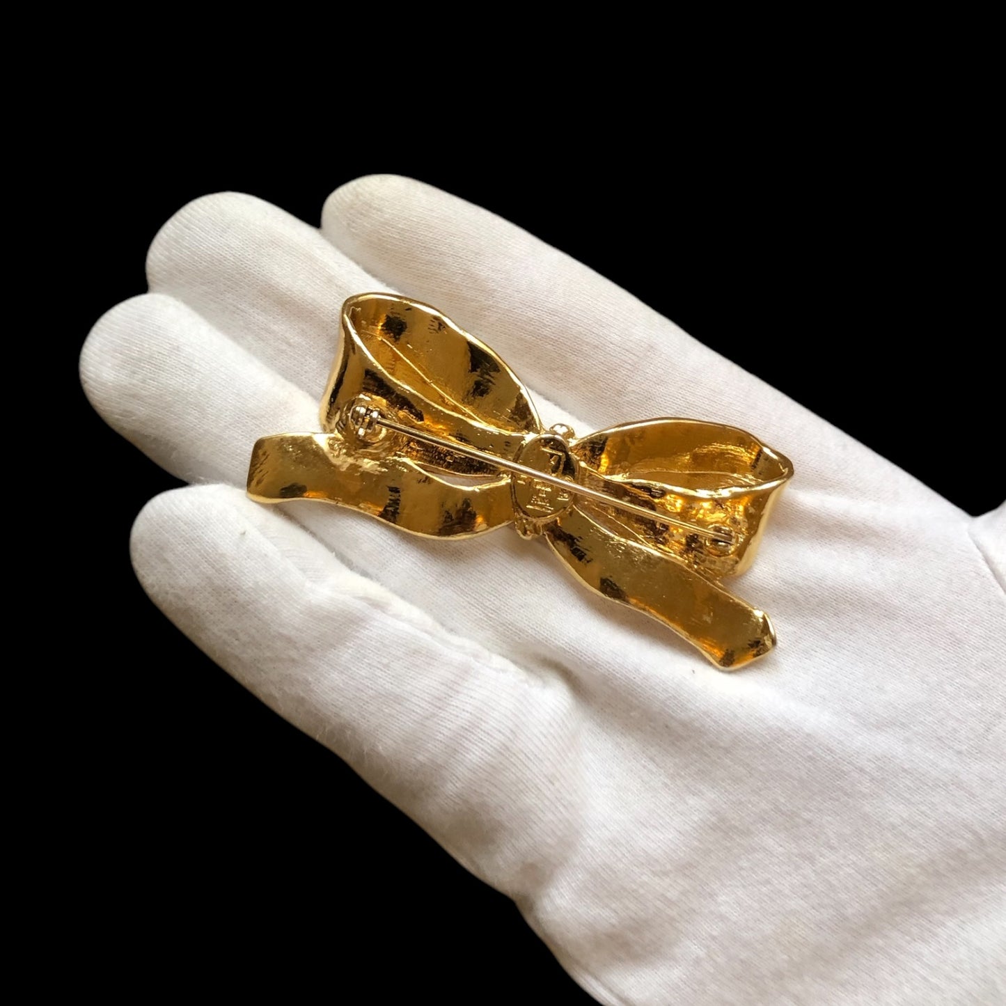 Brooch signed “Yves Saint Laurent”
