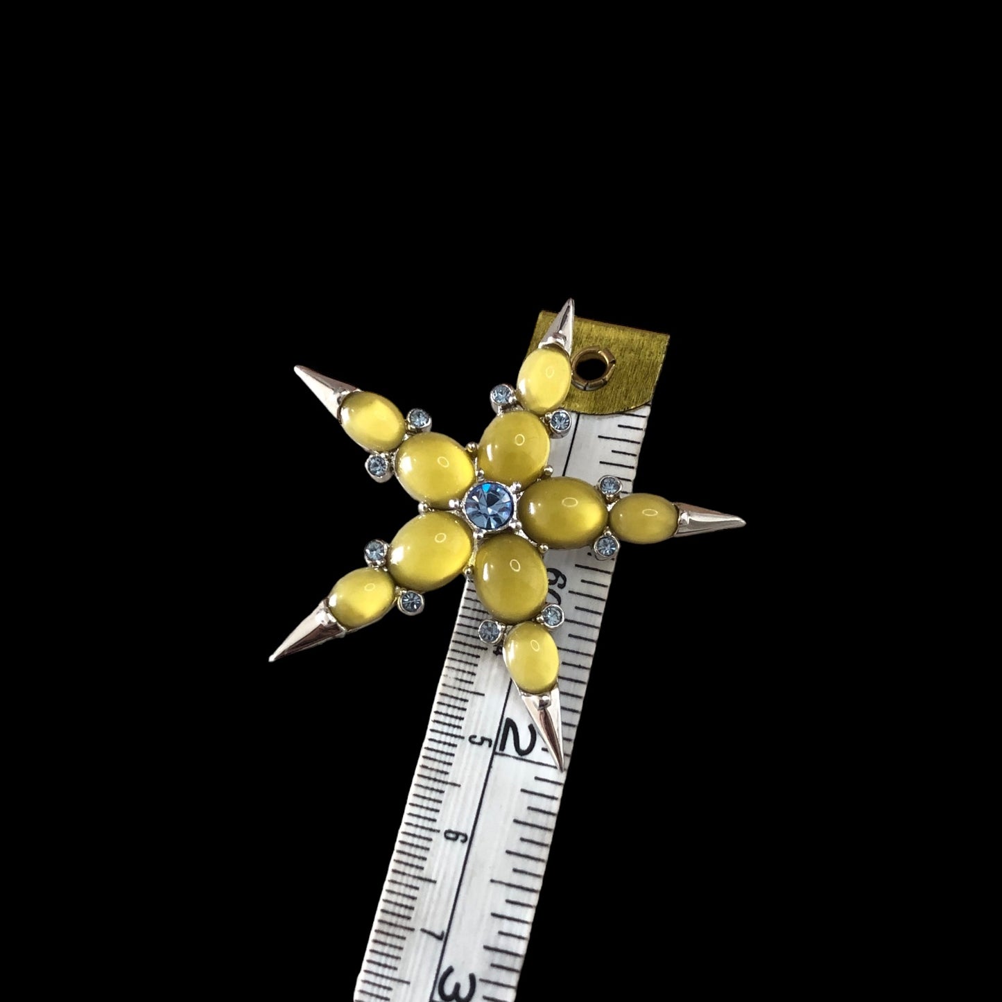 Brooch signed "Nina Ricci"
