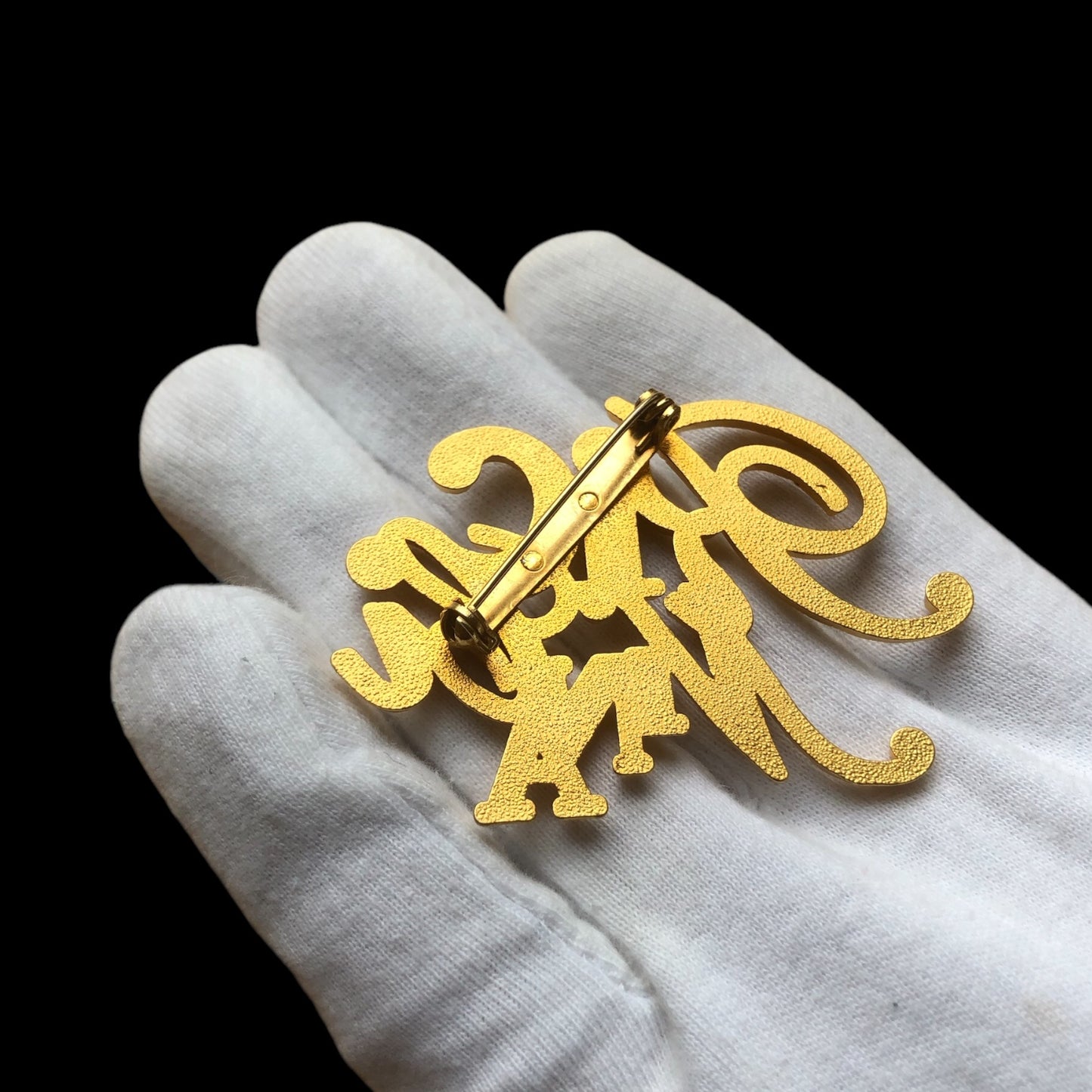 Brooch signed “Nina Ricci”