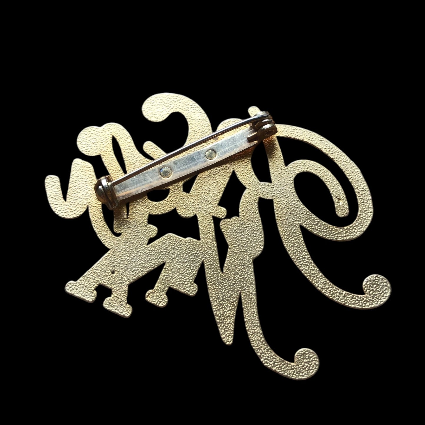 Brooch signed “Nina Ricci”